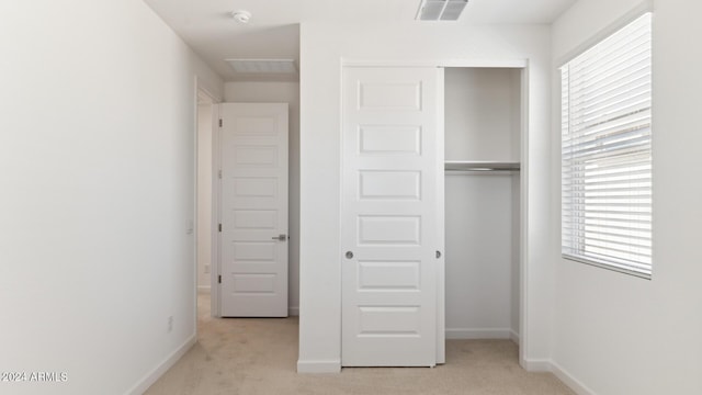 7384 W Buckhorn Trl, Peoria, AZ 85383 - unfurnished bedroom featuring light carpet, a closet, and multiple windows