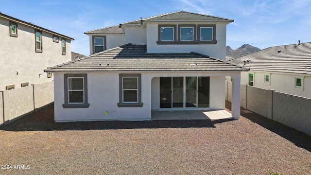 7384 W Buckhorn Trl, Peoria, AZ 85383 - back of house featuring stucco siding, a fenced backyard, and a patio area