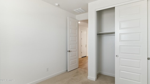 7384 W Buckhorn Trl, Peoria, AZ 85383 - unfurnished bedroom featuring light carpet, a closet, and baseboards
