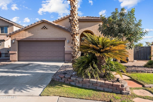 15912 W Central St, Surprise, AZ 85374 - mediterranean / spanish house with a garage, stucco siding, driveway, and a tile roof