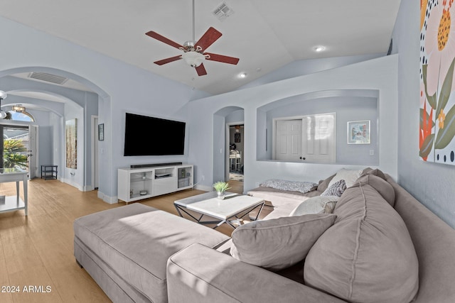 15912 W Central St, Surprise, AZ 85374 - living area with arched walkways, lofted ceiling, ceiling fan, light wood-style floors, and baseboards