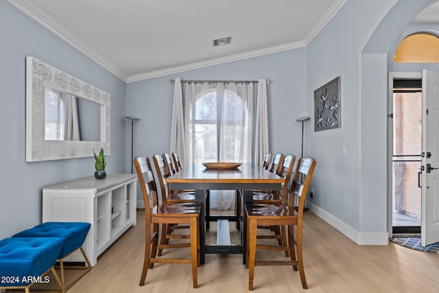 15912 W Central St, Surprise, AZ 85374 - dining room featuring crown molding, light wood-style floors, arched walkways, and baseboards