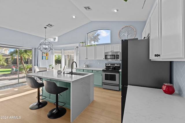 15912 W Central St, Surprise, AZ 85374 - kitchen featuring stainless steel appliances, a sink, white cabinetry, light countertops, and a chandelier