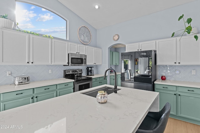15912 W Central St, Surprise, AZ 85374 - kitchen with appliances with stainless steel finishes, green cabinetry, a sink, white cabinetry, and recessed lighting
