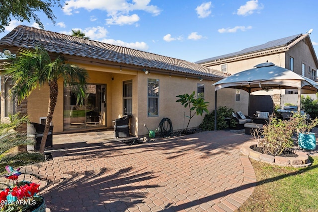 15912 W Central St, Surprise, AZ 85374 - rear view of house with a gazebo, a patio, a tiled roof, and stucco siding