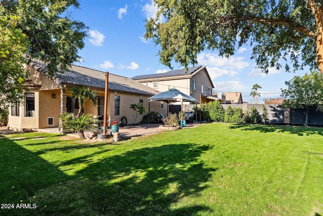 15912 W Central St, Surprise, AZ 85374 - rear view of house featuring a patio, a tiled roof, and stucco siding