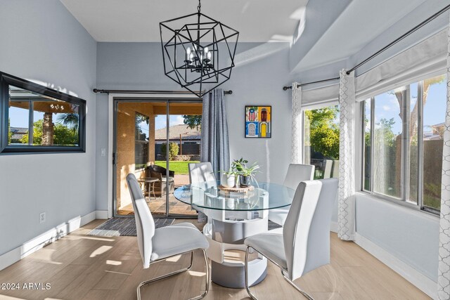 15912 W Central St, Surprise, AZ 85374 - dining area featuring baseboards, a chandelier, and wood finished floors