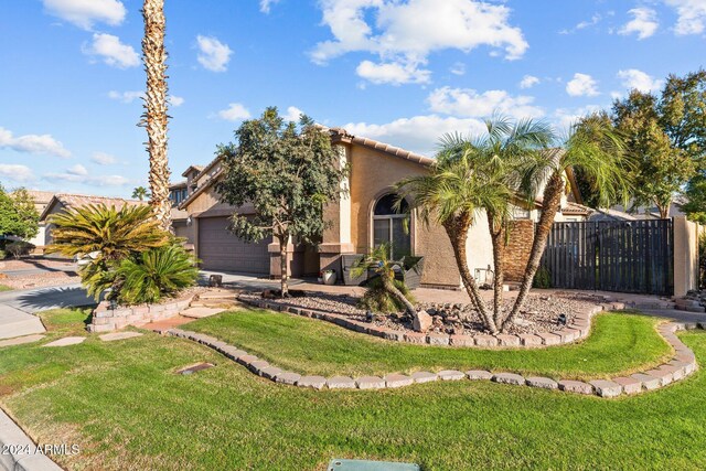 15912 W Central St, Surprise, AZ 85374 - view of front facade with stucco siding, a garage, driveway, and a tile roof