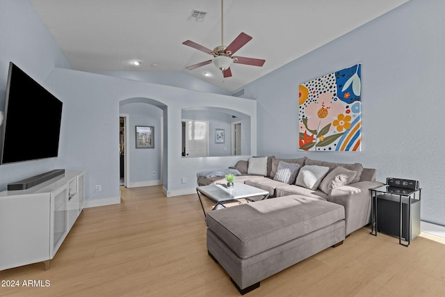 15912 W Central St, Surprise, AZ 85374 - living room with arched walkways, lofted ceiling, ceiling fan, light wood finished floors, and baseboards