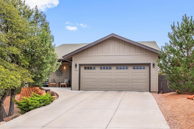 ranch-style home featuring a garage, concrete driveway, roof with shingles, and board and batten siding