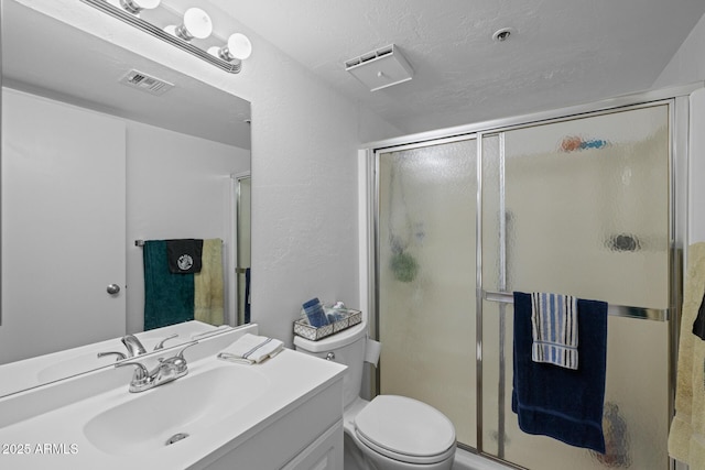 12123 W Bell Rd Unit 211, Surprise, AZ 85378 - full bathroom with vanity, a stall shower, and a textured ceiling