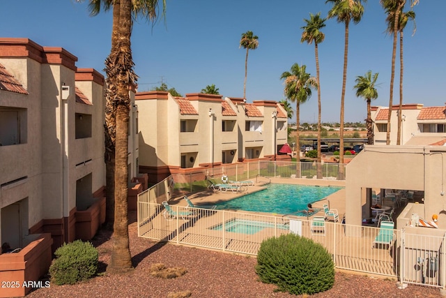 12123 W Bell Rd Unit 211, Surprise, AZ 85378 - community pool featuring a patio area and a residential view