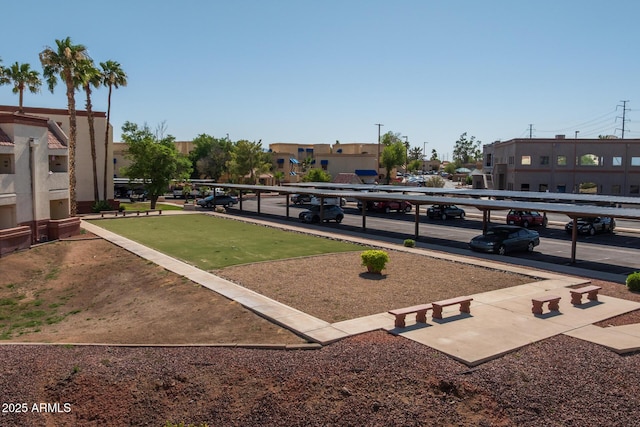 12123 W Bell Rd Unit 211, Surprise, AZ 85378 - view of home's community featuring covered parking, a bocce ball area, and a residential view