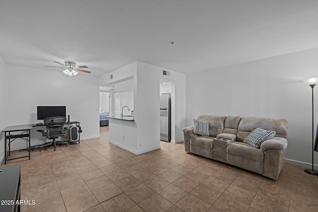 12123 W Bell Rd Unit 211, Surprise, AZ 85378 - living area with an office area, ceiling fan, and tile patterned floors
