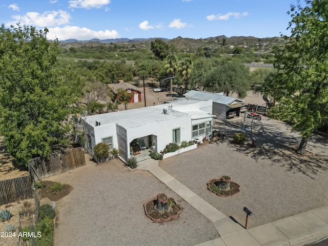 birds eye view of property featuring a mountain view