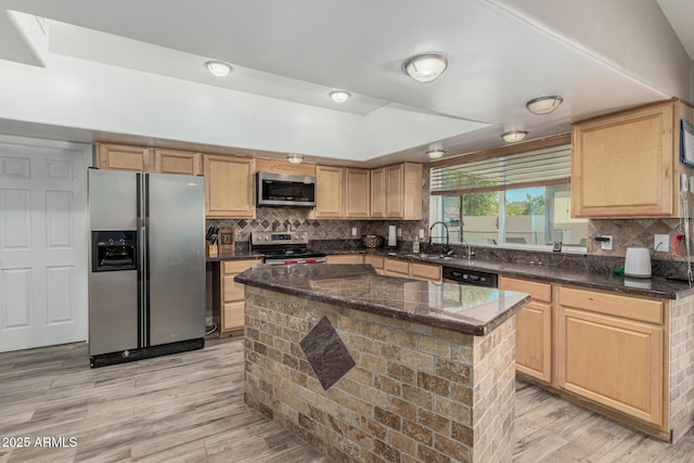 3061 W Betty Elyse Ln, Phoenix, AZ 85053 - kitchen featuring appliances with stainless steel finishes, light wood-type flooring, decorative backsplash, and light brown cabinets