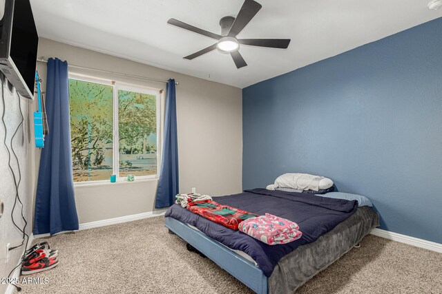 3061 W Betty Elyse Ln, Phoenix, AZ 85053 - bedroom with carpet floors and a ceiling fan