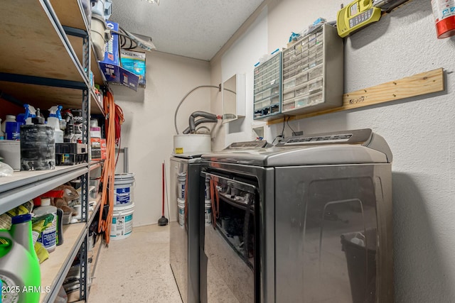 3061 W Betty Elyse Ln, Phoenix, AZ 85053 - washroom with washing machine and dryer and a textured ceiling