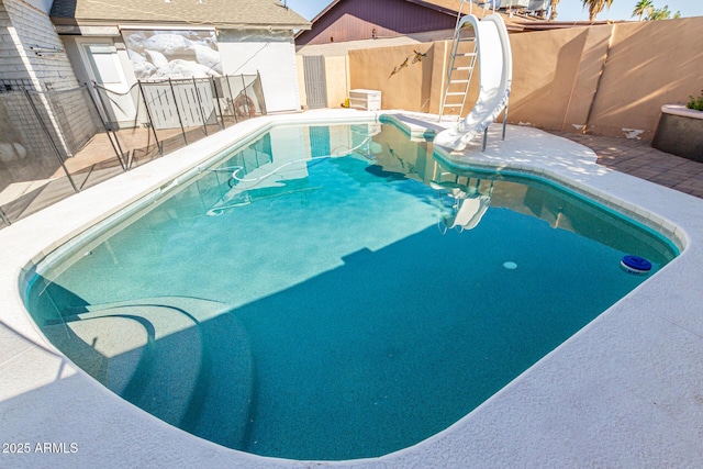 3061 W Betty Elyse Ln, Phoenix, AZ 85053 - view of pool with a water slide, a shed, and a patio
