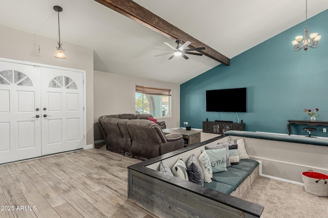 3061 W Betty Elyse Ln, Phoenix, AZ 85053 - living room featuring a ceiling fan, a chandelier, and wood finished floors
