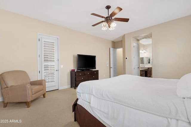 bedroom featuring light carpet, ensuite bath, a ceiling fan, baseboards, and visible vents