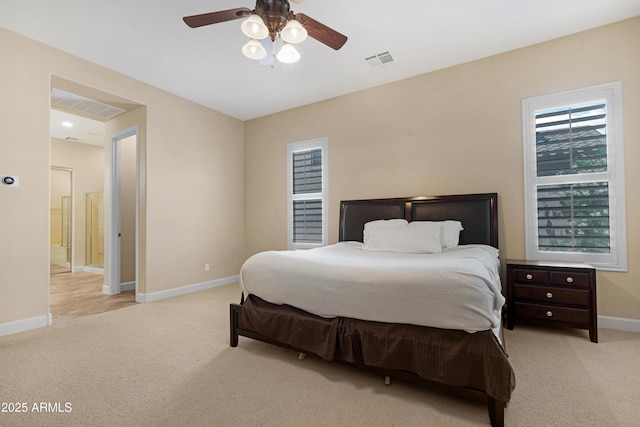 bedroom featuring baseboards, light carpet, and visible vents