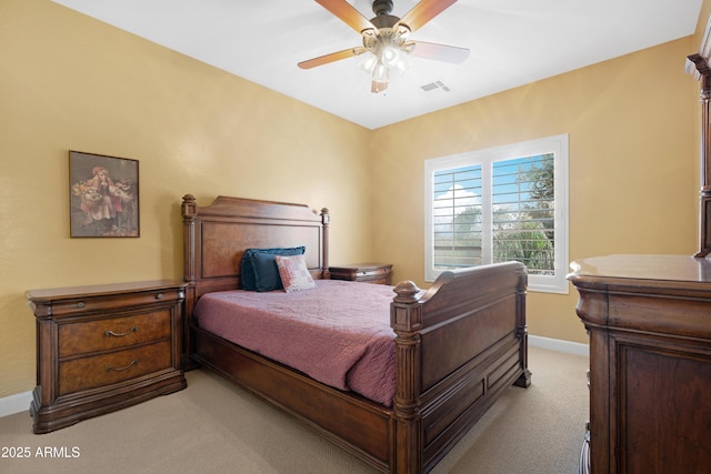 bedroom featuring a ceiling fan, baseboards, visible vents, and light carpet