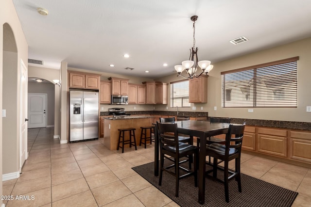 dining space with light tile patterned floors, recessed lighting, a notable chandelier, and visible vents