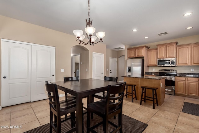 dining area featuring recessed lighting, light tile patterned flooring, arched walkways, visible vents, and a notable chandelier