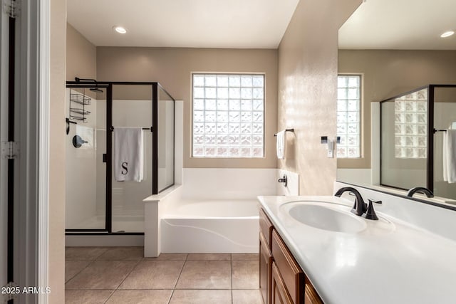 bathroom featuring a bath, a shower stall, tile patterned floors, recessed lighting, and vanity