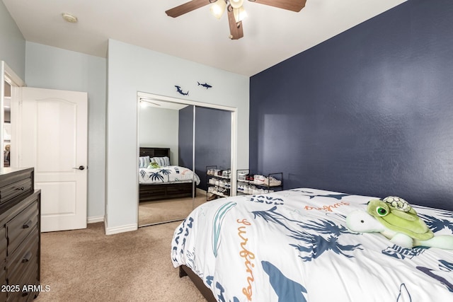 bedroom with carpet floors, baseboards, a closet, and ceiling fan