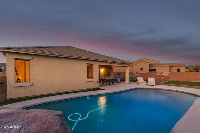 view of pool featuring a fenced in pool, fence, and a patio