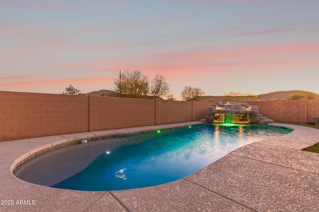 view of swimming pool featuring a fenced backyard and a fenced in pool