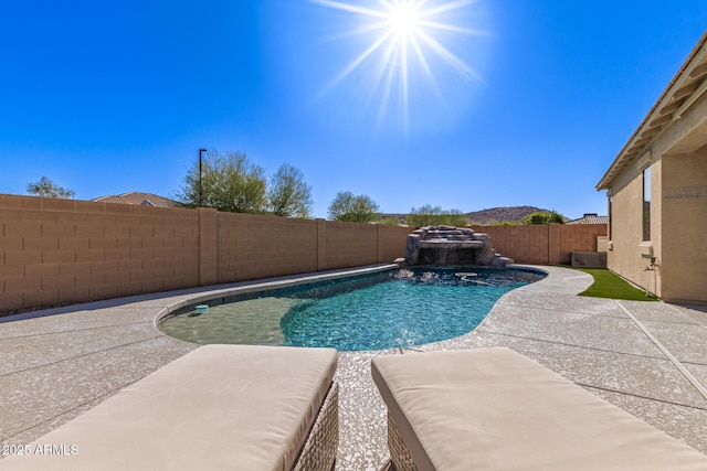 view of swimming pool featuring a patio, a fenced in pool, and a fenced backyard