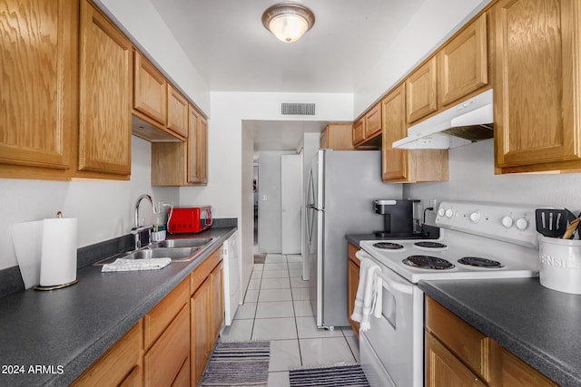 kitchen featuring sink, electric stove, and light tile patterned floors