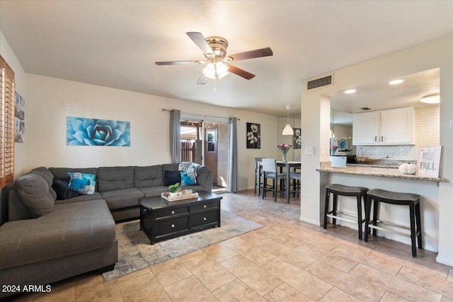 living room featuring ceiling fan