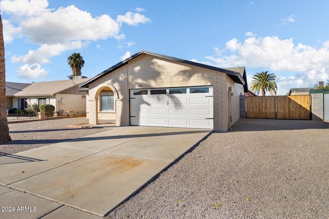 single story home featuring a garage