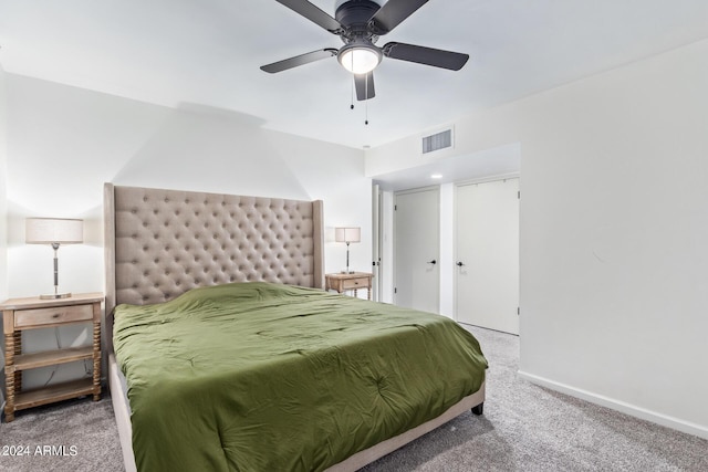bedroom featuring baseboards, visible vents, ceiling fan, and carpet