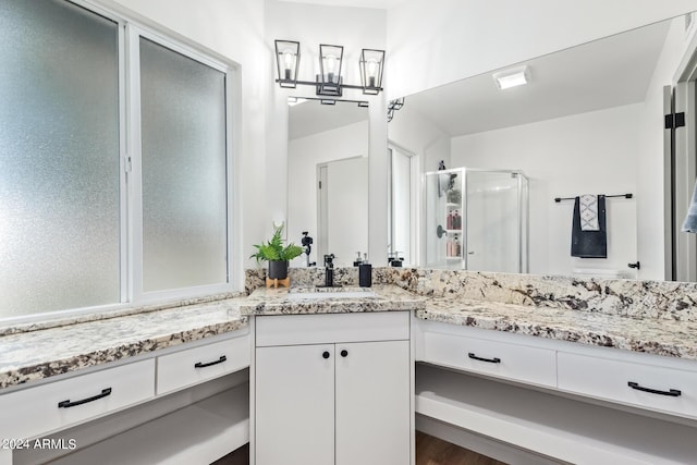 full bathroom featuring a shower stall and vanity