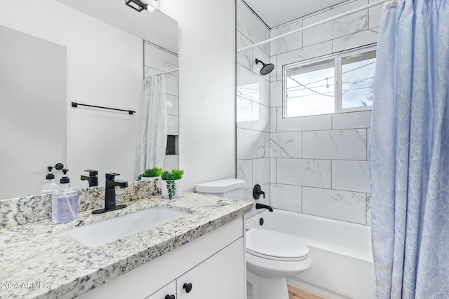 bathroom featuring toilet, vanity, and shower / bathtub combination with curtain