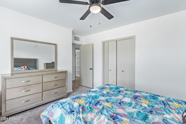 bedroom with light carpet, visible vents, a closet, and ceiling fan