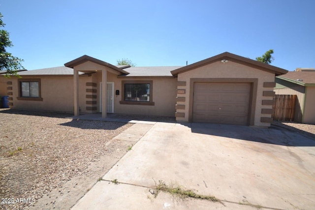 2036 N 64th Ln, Phoenix, AZ 85035 - ranch-style house featuring driveway, stucco siding, and an attached garage