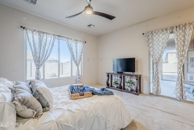 bedroom with access to exterior, carpet floors, and ceiling fan