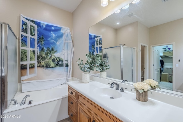 bathroom featuring vanity and separate shower and tub