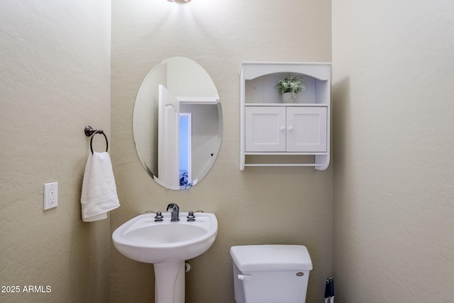 bathroom featuring toilet