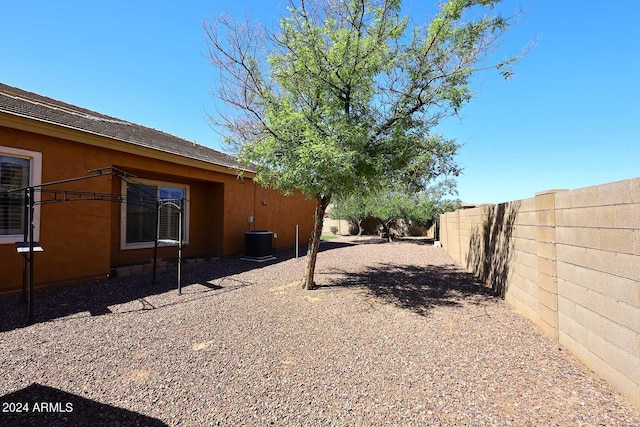 view of yard featuring central AC unit