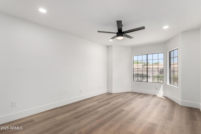 5230 E Brown Rd Unit 114, Mesa, AZ 85205 - unfurnished room with light wood finished floors, a ceiling fan, and recessed lighting