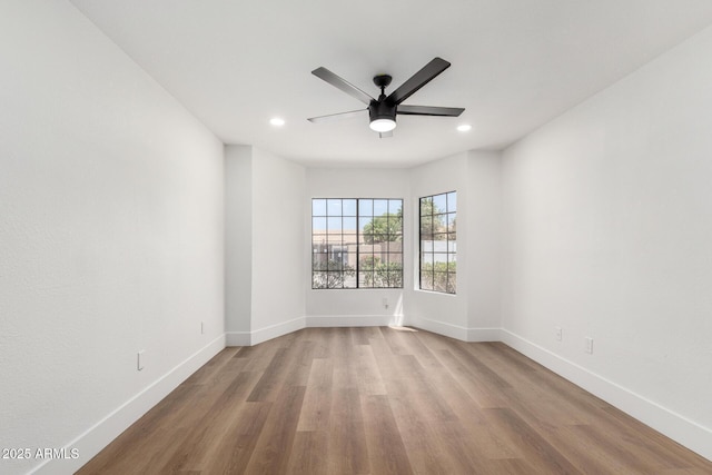 5230 E Brown Rd Unit 114, Mesa, AZ 85205 - spare room with ceiling fan, wood finished floors, and recessed lighting