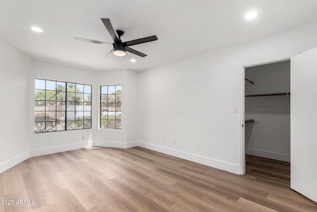 5230 E Brown Rd Unit 114, Mesa, AZ 85205 - unfurnished bedroom featuring recessed lighting, light wood finished floors, a spacious closet, and ceiling fan