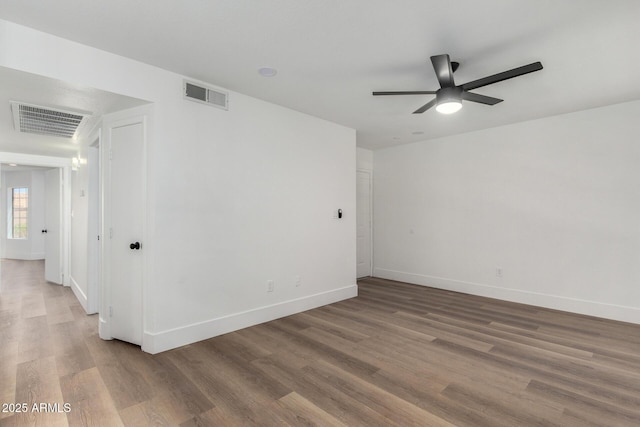 5230 E Brown Rd Unit 114, Mesa, AZ 85205 - spare room with a ceiling fan and wood finished floors